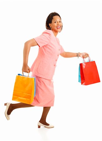 shopping woman bags running - African-american female shopper running from one store to another for bargains.  Isolated on white. Stock Photo - Budget Royalty-Free & Subscription, Code: 400-04299078