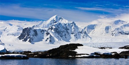 Beautiful snow-capped mountains against the blue sky in Antarctica Stock Photo - Budget Royalty-Free & Subscription, Code: 400-04299212