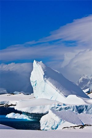 simsearch:400-04299207,k - Huge iceberg in Antarctica, blue sky, azure water, sunny day Stock Photo - Budget Royalty-Free & Subscription, Code: 400-04299228