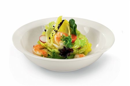 Fresh salad in white bowl isolated on a white background. Photographie de stock - Aubaine LD & Abonnement, Code: 400-04299967