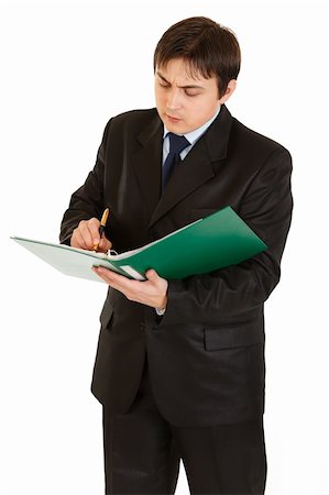 simsearch:400-05285550,k - Serious young businessman holding folder in  hand and making notes in document  isolated on white Stockbilder - Microstock & Abonnement, Bildnummer: 400-04290199