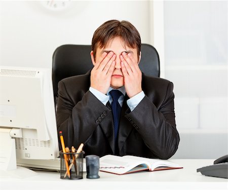 simsearch:400-05900668,k - Modern business man sitting at office desk and making see no evil gesture Stock Photo - Budget Royalty-Free & Subscription, Code: 400-04290262
