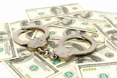 Handcuffs on money background, business security concept Stock Photo - Budget Royalty-Free & Subscription, Code: 400-04290396