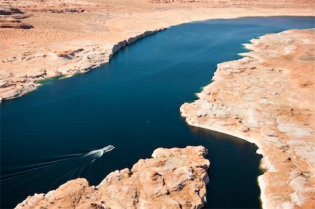 powell - Page, Arizona: A tour boar motors up an arm of Lake Powell in the Glen Canyon National Recreation Area. Stock Photo - Budget Royalty-Free & Subscription, Code: 400-04290980
