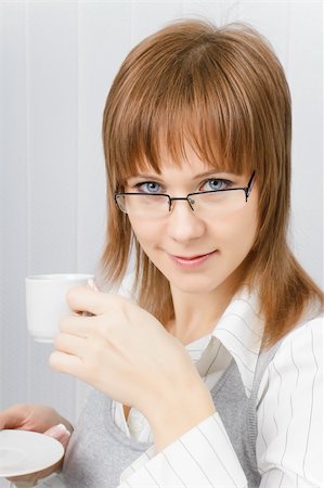 simsearch:400-04188263,k - attractive girl in glasses with a cup of coffee in hand Foto de stock - Super Valor sin royalties y Suscripción, Código: 400-04291567