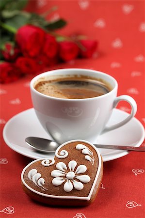 Gingerbread heart with coffee and red roses on red background. Shallow dof Stock Photo - Budget Royalty-Free & Subscription, Code: 400-04291992
