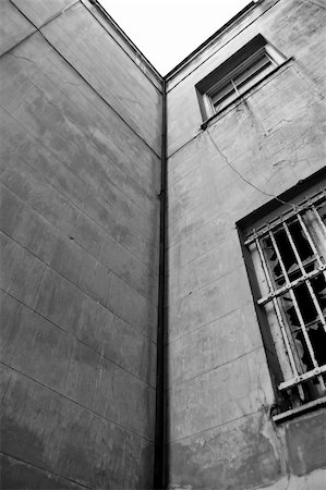 simsearch:400-05352419,k - Abandoned building exterior. Broken window and weathered wall. Fotografie stock - Microstock e Abbonamento, Codice: 400-04292213