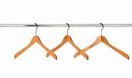 wooden coat hangers on a clothes rail isolated on white Stock Photo - Budget Royalty-Free & Subscription, Code: 400-04292277
