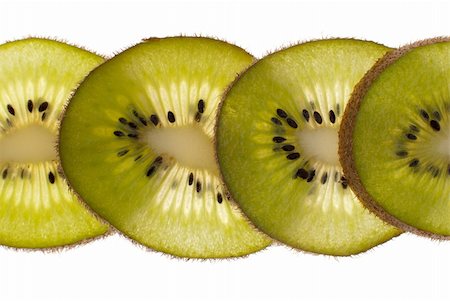 simsearch:400-05303673,k - Close up of kiwi slices isolated over white background. Photographie de stock - Aubaine LD & Abonnement, Code: 400-04292319