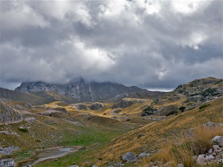 simsearch:400-05927708,k - Prutas peak in National park Durmitor in Montenegro. Low nimbus clouds Stockbilder - Microstock & Abonnement, Bildnummer: 400-04292501