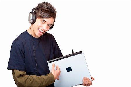 sing along - Teenager with headphones plays guitar on laptop. Isolated on white background. Stock Photo - Budget Royalty-Free & Subscription, Code: 400-04292702