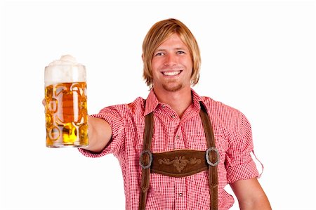 dimple mug - Happy smiling man with leather trousers (lederhose) holds oktoberfest beer stein. Isolated on white background. Stock Photo - Budget Royalty-Free & Subscription, Code: 400-04292753