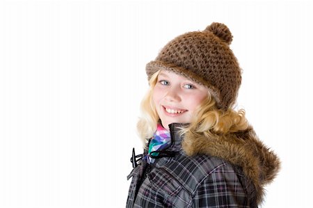 Young girl with cap, scarf and jacket smiles happy. Isolated on white background. Stock Photo - Budget Royalty-Free & Subscription, Code: 400-04292780