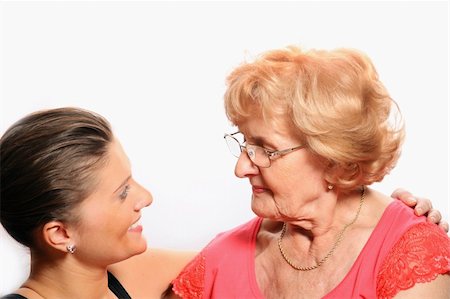 simsearch:400-04300757,k - A picture of grandmother and granddaughter talking over white background Photographie de stock - Aubaine LD & Abonnement, Code: 400-04292799