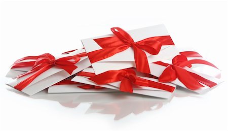 simsearch:400-04234530,k - Gift envelopes with awesome red bows isolated on white Stock Photo - Budget Royalty-Free & Subscription, Code: 400-04292959
