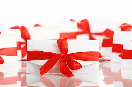 simsearch:400-04234530,k - Gift envelopes with awesome red bows isolated on white Stock Photo - Budget Royalty-Free & Subscription, Code: 400-04292960