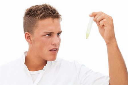 Handsome blond researcher inspecting test result in test-tube; isolated on white Stock Photo - Budget Royalty-Free & Subscription, Code: 400-04304414