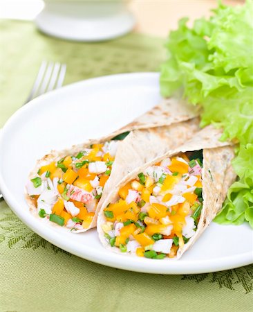 Served wheat wraps filled with salad and crab meat. Fotografie stock - Microstock e Abbonamento, Codice: 400-04304681