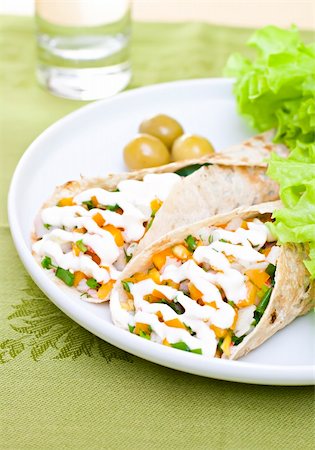 Served wheat wraps with olive, filled with salad, crab meat and mayonnaise. Fotografie stock - Microstock e Abbonamento, Codice: 400-04304682