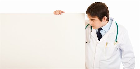 simsearch:400-05745246,k - Medical doctor  looking at blank billboard isolated on white Photographie de stock - Aubaine LD & Abonnement, Code: 400-04305394