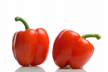 couple of red bell peppers on white background Foto de stock - Royalty-Free Super Valor e Assinatura, Número: 400-04305745