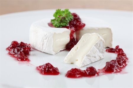 simsearch:400-06741554,k - Camembert with cranberry jam and parsley on white plate. Shallow dof Foto de stock - Royalty-Free Super Valor e Assinatura, Número: 400-04305810