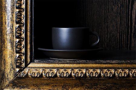 black cup of coffee in a golden frame Stock Photo - Budget Royalty-Free & Subscription, Code: 400-04305917