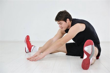 young man in fintess sport club exercise withweights and relaxing Stock Photo - Budget Royalty-Free & Subscription, Code: 400-04305992