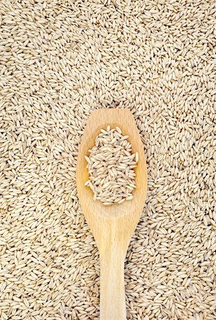 simsearch:400-04317325,k - Wooden spoon and dried husked oats Stock Photo - Budget Royalty-Free & Subscription, Code: 400-04306375