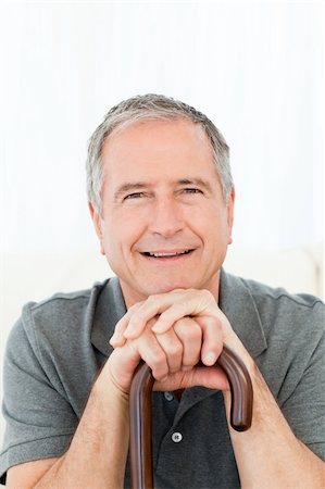 Mature man with his walking stick on his bed at home Stock Photo - Budget Royalty-Free & Subscription, Code: 400-04306408