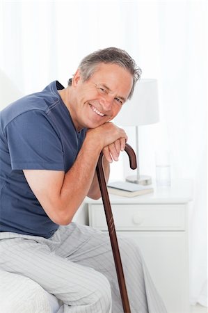 Retired man with his walking stick on his bed Stock Photo - Budget Royalty-Free & Subscription, Code: 400-04306424