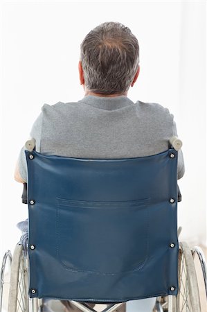 simsearch:400-04327098,k - Mature man in his wheelchair with his back to the camera at home Stock Photo - Budget Royalty-Free & Subscription, Code: 400-04306445
