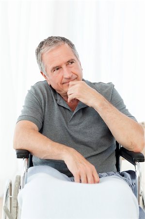 simsearch:400-04327098,k - Retired man in his wheelchair at home Stock Photo - Budget Royalty-Free & Subscription, Code: 400-04306443