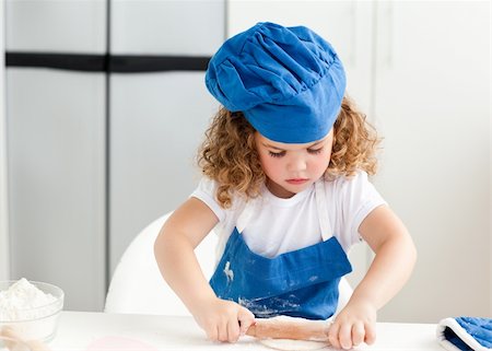 Little girl baking in the kitchen at home Stock Photo - Budget Royalty-Free & Subscription, Code: 400-04306456