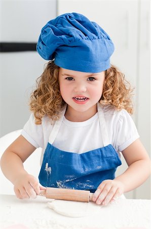 rolling over - Little girl baking in the kitchen at home Stock Photo - Budget Royalty-Free & Subscription, Code: 400-04306457