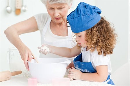 rolling over - A little girl  baking with her grandmother at home Stock Photo - Budget Royalty-Free & Subscription, Code: 400-04306470