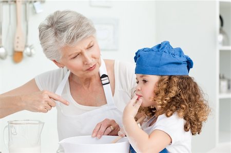A little girl  baking with her grandmother at home Stock Photo - Budget Royalty-Free & Subscription, Code: 400-04306472