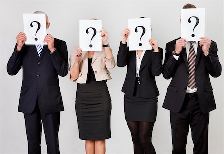 Group of unidentifiable business people hiding under question marks Fotografie stock - Microstock e Abbonamento, Codice: 400-04307317