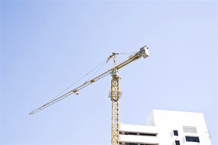 simsearch:400-06075932,k - Construction crane on blue sky Fotografie stock - Microstock e Abbonamento, Codice: 400-04307371