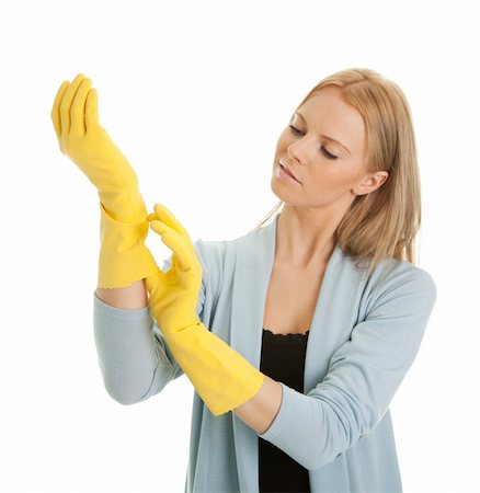 rubber hand gloves - Cheerful housewife putting on gloves before cleaning. Isolated on white Stock Photo - Budget Royalty-Free & Subscription, Code: 400-04307605