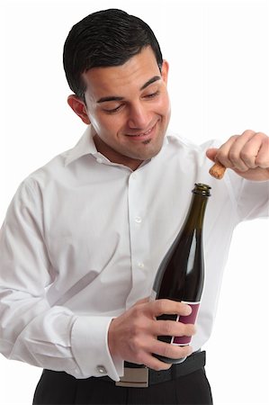 simsearch:400-04765778,k - A man or waiter removes a cork from a bottle ready for a celebration.  White background. Stock Photo - Budget Royalty-Free & Subscription, Code: 400-04307741