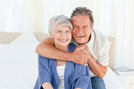 simsearch:400-05711437,k - Senior couple looking at the camera  at home Stock Photo - Budget Royalty-Free & Subscription, Code: 400-04307866