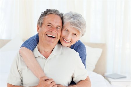 simsearch:400-05711437,k - Senior couple looking at the camera  at home Stock Photo - Budget Royalty-Free & Subscription, Code: 400-04307867