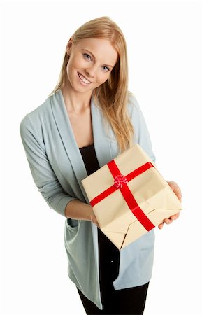 Happy woman holding gift box. Isolated on white Fotografie stock - Microstock e Abbonamento, Codice: 400-04308374