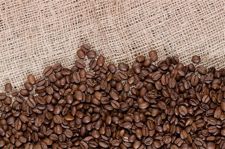 Background image of many coffee beans spilled out on a canvas material Stock Photo - Budget Royalty-Free & Subscription, Code: 400-04308467