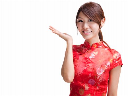 simsearch:400-06142860,k - Asian Chinese woman in Traditional Chinese Cheongsam gesturing Fotografie stock - Microstock e Abbonamento, Codice: 400-04308523