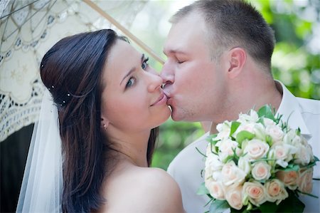 Newlyweds portrait in sunny summer park Stock Photo - Budget Royalty-Free & Subscription, Code: 400-04308597
