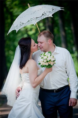 Newlyweds portrait in sunny summer park Stock Photo - Budget Royalty-Free & Subscription, Code: 400-04308593