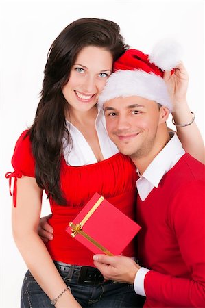 simsearch:400-04805110,k - happy young couple smiling in red christmas clothes and gift box Stock Photo - Budget Royalty-Free & Subscription, Code: 400-04308642