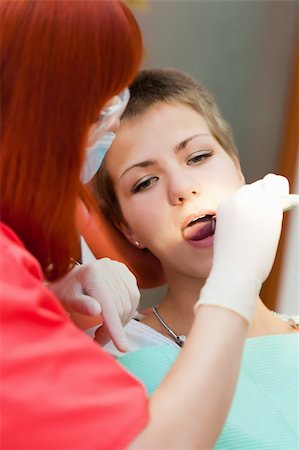simsearch:400-04340930,k - Image of young lady with dentist over her checking oral cavity Foto de stock - Super Valor sin royalties y Suscripción, Código: 400-04308651